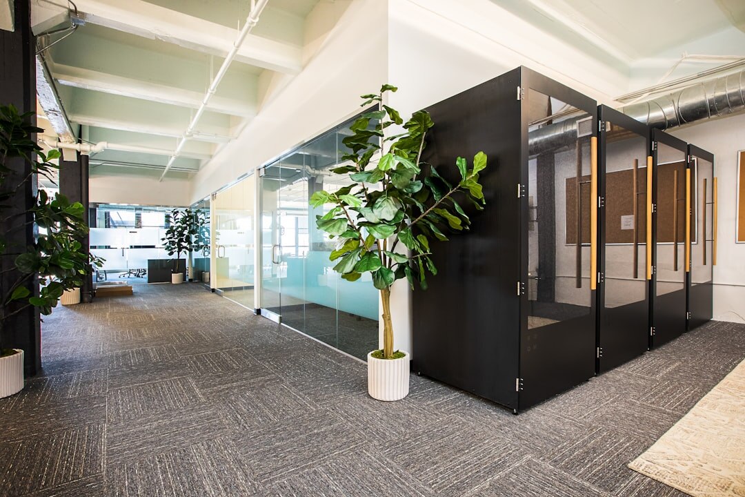 Modern startup office with glass walls and team collaboration