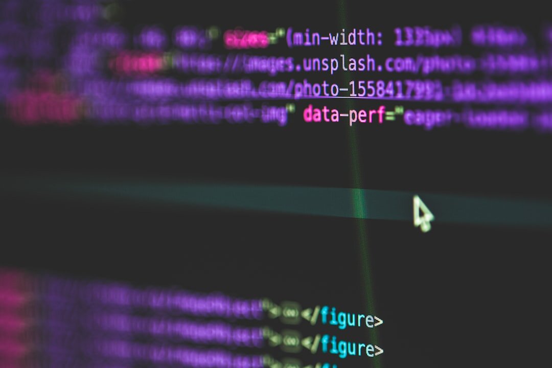 Code on monitor screen in dark developer environment