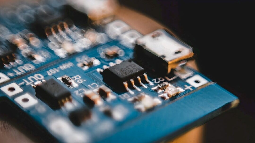 Close-up of illuminated circuit board with blue light